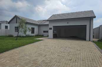 Completed residential building and paved driveway